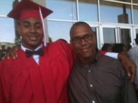 Me taking a picture with my nephew at his high school graduation in Texas. He's now a sophomore in college.